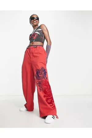 Jaded London low rise bootcut jeans with belt in multi blossom print co-ord