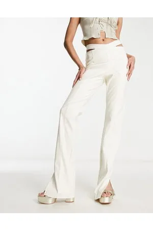 The Couture Club High waisted cut out trousers in cream