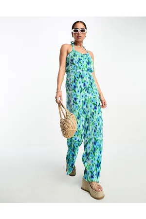 Monki Jersey plisse cross back detail jumpsuit in blue and green flower print