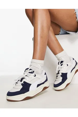 PUMA 180 trainers in white and navy