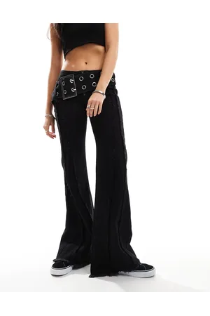 Minga London grunge flare jeans with oversized buckle belt in