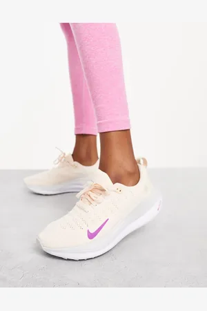 Nike React Infinity Run 4 trainers in beige and