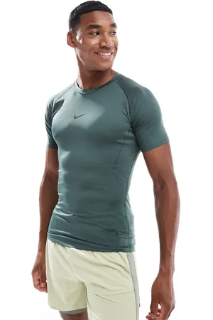 Nike Pro tight short sleeve top in green