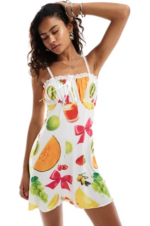 Reclaimed Mini holiday sundress in all over fruit print