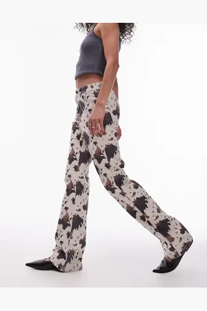 Topshop Mid rise 90s flare jeans in cow print