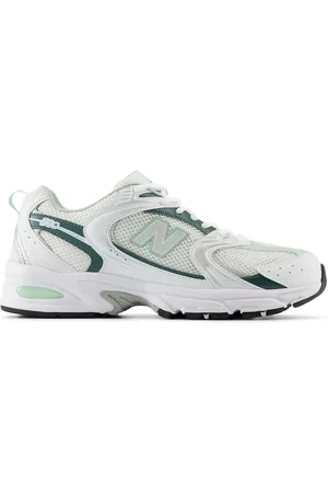 New Balance 530 trainers in and metallic green