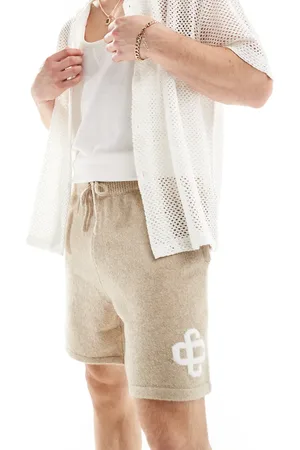 The Couture Club Emblem knitted shorts in beige