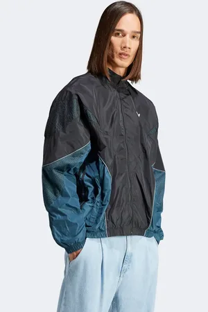 adidas Rekive woven track top in black/dark