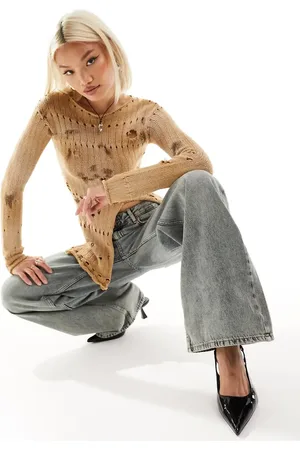 The Kript Y2K overdye knitted rib jumper with distressing and front split in
