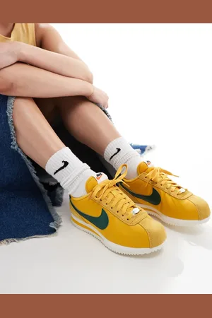 Nike Cortez TXT trainers in yellow and