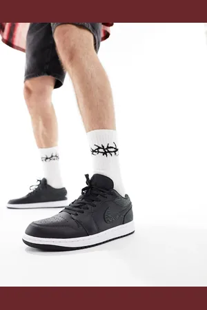 Jordan Air 1 Low trainers in black and