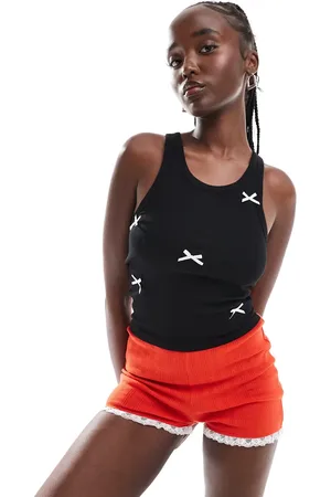 Monki Jersey vest top in with white applique bows
