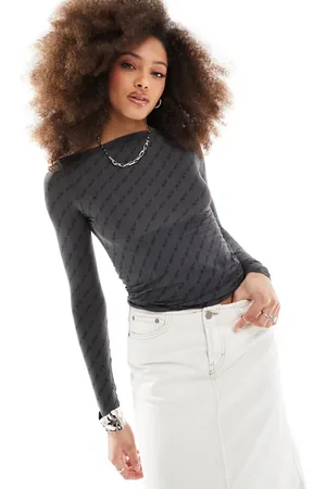 Weekday Sheer long sleeve boatneck top with italic print in