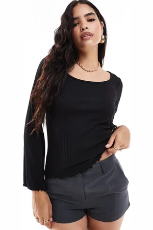 VILA Ribbed long sleeve scoop neck top with lettuce edge detail in