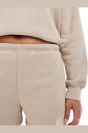 The Couture Club Co-ord CTRE varsity shorts in beige
