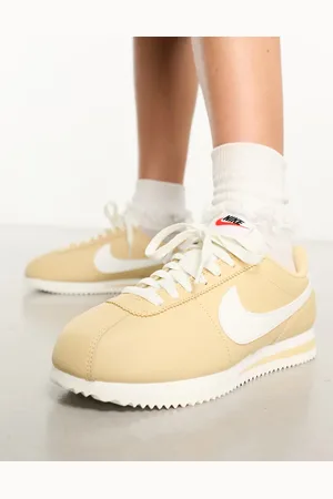 Nike Cortez leather trainers in beige and off white