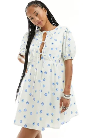 Glamorous Bow tie back mini smock dress in blue daisy floral