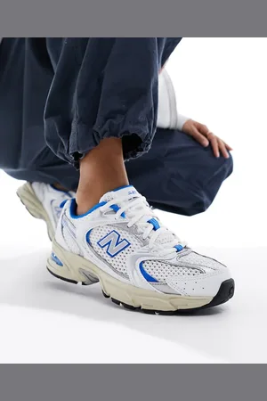 New Balance 530 trainers with vintage sole in and blue