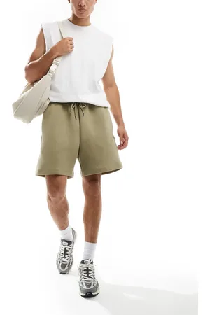 Nike Tech Fleece Reimagined oversized shorts in olive