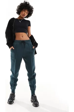 Nike Tech Fleece joggers in dark