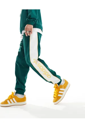 adidas Linear logo joggers in dark and yellow