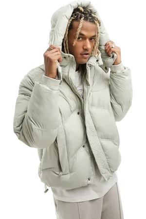 The Couture Club Oversized puffer jacket in beige with zipper sleeve detail
