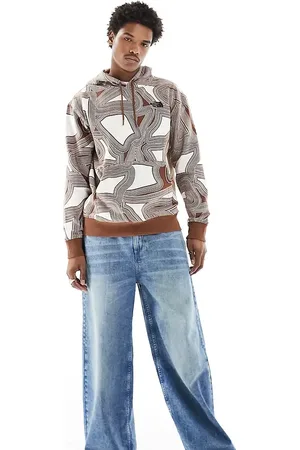 The North Face Essential oversized fleece hoodie in geo print Exclusive at ASOS