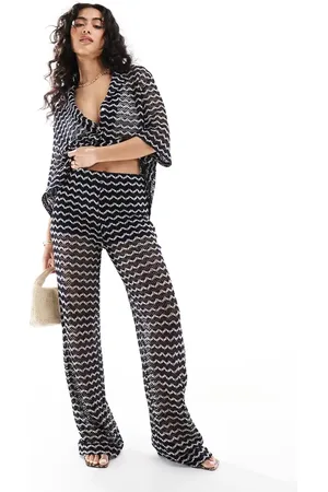 EDITED the label Crochet look trouser co-ord in black and cream stripe