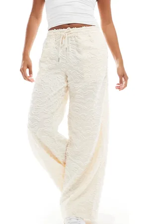 VERO MODA Wide leg tie waist trousers with textured applique in cream