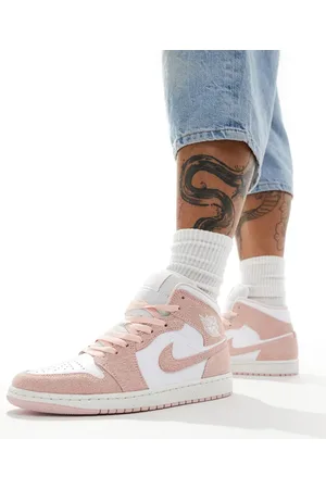Jordan Air 1 Mid SE trainers in and pink .