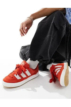 adidas Adimatic gum sole trainers in red and white