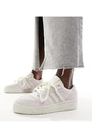 adidas Rivalry trainers in beige and off white