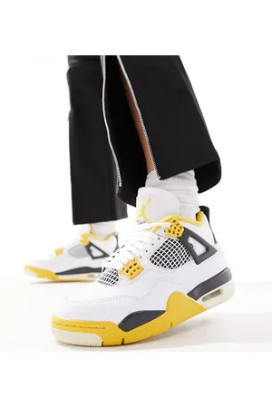 Jordan Air 4 retro trainers in and yellow