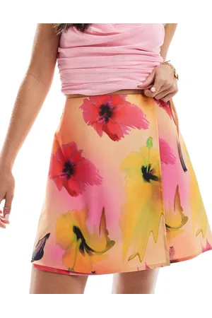 Monki Mini wrap skirt with tie up side in hibiscus print
