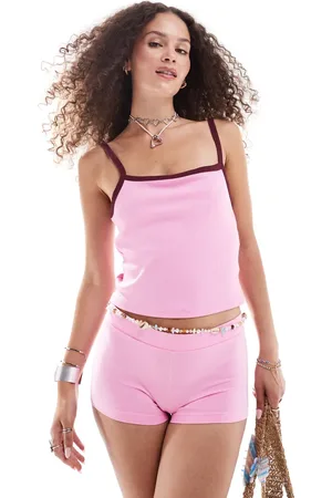 Monki Cropped slim fit strappy vest top in with dark red contrast binding