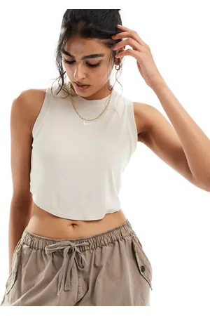 Nike Essential ribbed cropped tank top in beige