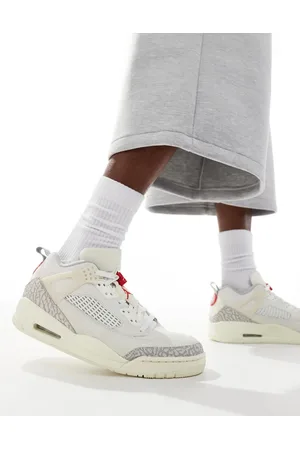 Jordan Spizike low trainers in ivory and grey