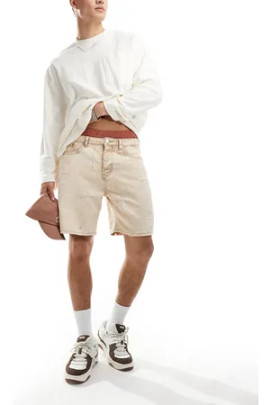 Liquor N Poker Distressed cross denim shorts in beige