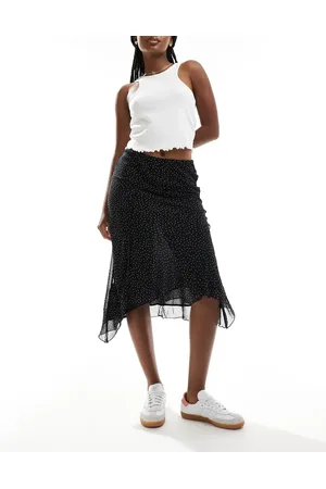 MANGO Aysmettric hem spot printed midi skirt in