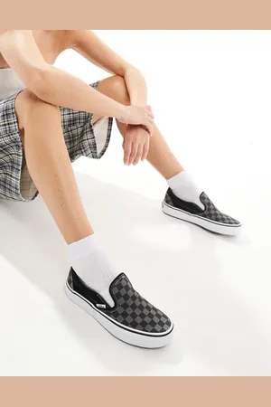 Vans Classic Slip On trainers in black and checkerboard