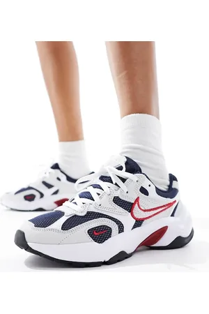 Nike Runninspo trainers in black and white with red detail