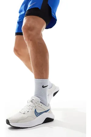 Nike Legend Essential 3 trainers in and blue