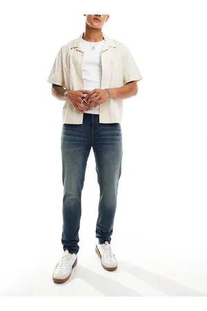 ASOS Skinny jeans with yellow tint in dark wash
