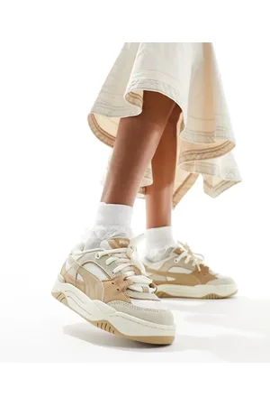 PUMA 180 trainers in tan and white