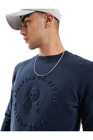 SCALPERS Skull emboss sweater in