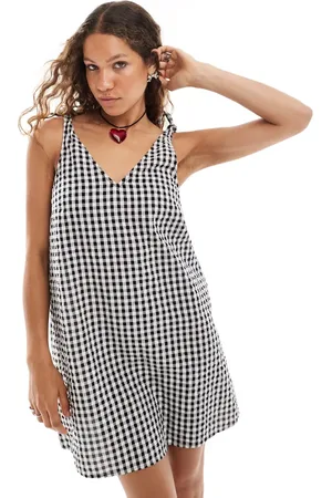 Monki Seersucker bow tie strap mini dress with side pockets in black and white gingham