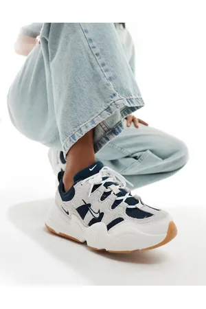 Nike Tech Hera trainers in off with navy detail