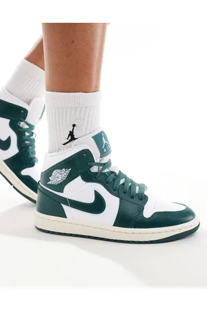 Jordan Air 1 Mid trainers in and white