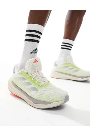 adidas Adidas Running Supernova Stride trainers in off and lime