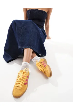 adidas Handball Spezial trainers in yellow and pink with gum sole